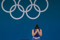 | Photo: PTI/Ravi Choudhary : Mirabai Chanu after her unsuccessful third attempt in weightlifting event 